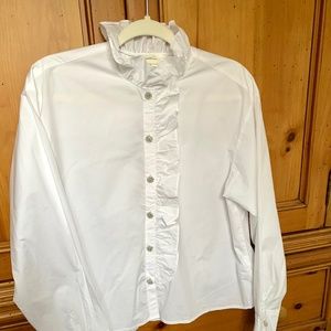 Crisp white, high neck blouse with jeweled buttons